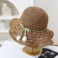 Dettaglio macro della trama ad ananas su un cappello di paglia fatto a mano. - Cachi Tulipano Bianco