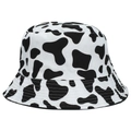 Dettaglio del cappello a secchiello con stampa mucca che mostra trama del tessuto e cuciture - Taglia unica / Nero e Bianco