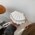 Elegant white shell-shaped crossbody bag with pearl handle and textured faux leather finish - White