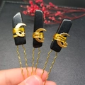 Detail of three handmade hair pins with natural black stone, gold wire and star charms - Obsidian + Gold Moon Star