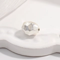 S925 sterling silver irregular faceted geometric spacer bead on an embossed white base - Silver Large