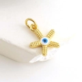 Detailed macro of gold-plated evil eye star charm with blue zircon for jewelry making - Blue Eye Starfish