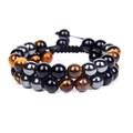 Double-layered braided bracelet with tiger eye beads and black metallic beads on white background - Tiger Eye + Hematite + Black Agate