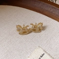 Macro detail of gold horse earrings with crystal pavé on a rustic wooden tray - 30# Silver Pin - Rhinestone Pony Hollow