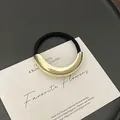 Minimalist ponytail holder featuring black elastic band and polished gold curved metal piece - GD434 Gold Smooth Single Arc