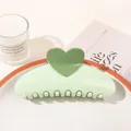 Detail of sweet green heart hair claw clip on a ceramic tray in an elegant home setting - Heart Semicircle / Light Green