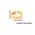 Detail view of a gold-finish titanium ring with twisted design and dimension markings - Cross Twist Minimalist Open Ring