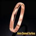 Elegant 6mm rose gold stainless steel teardrop bangle with a polished domed surface - Outer Arc (40-A-6) / 6mm Width / Rose Gold