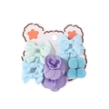 Close-up of pastel kids hair accessory set with bows, floral and plush ball details - Light Green & Purple Blue Series
