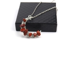 Chakra crescent moon necklace with red natural crystals wrapped in silver wire on black gift box - Red Jasper