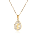 Detailed close-up of gold teardrop pendant featuring a central saint icon and zircon stones - Gold Teardrop Rhinestone Virgin Mary Necklace