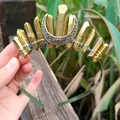 Macro detail of handmade gold crystal moon crown featuring wire wrapped stones and crescent - Gold Crystal with Silver Wire & Moon