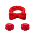 Detailed view of red plush bow headband and matching wristband set for face washing - Red Headband & Wristbands Set