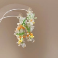 Detailed macro of handmade beaded earrings with white pearls and green crystals - 117# Silver Needle - White - Green.