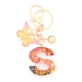 Resin initial S keychain with orange sequins, pink butterfly and gold-tone lobster clasp - Letter S