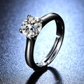 Macro detail of a one carat moissanite ring with a classic four-prong setting in black finish - Y107 Gun Black Four-Prong