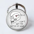 Silver round keychain featuring a skull with a red heart and I Can't Get You Out Of My Head text - Creative Illustration/Get you out of my head
