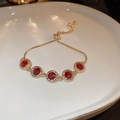 Gold-plated bracelet with five round red rubies and cubic zirconia on a white plate - Red Circle Sliding Buckle Style (6#)