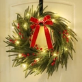 Artificial Christmas wreath with red bow, berries and LED lights on a white door - H3123/55 Wreath (With Light)