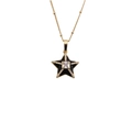 Close-up of a gold star pendant necklace with black zircon and central clear gemstone - Black