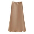 Detail showing smooth champagne satin fabric and high-waisted A-line midi skirt cut - Caramel color