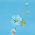 Detailed crochet blue tung flower arrangement in a white ceramic vase on blue background - Blue - Single-headed Tung Tree Flower Branch (2 Flower Buds)