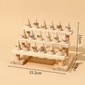 Three-tier wooden ring display stand with natural finish and conical ring holders - 3-Layer Solid Wood Ring Stand