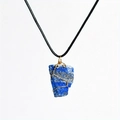 Detail of wire-wrapped raw lapis lazuli pendant on a black cord necklace - Lapis Lazuli