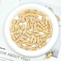 Detail of yellow fish-shaped ceramic beads for DIY jewelry making with threaded hole - Light Coffee