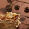 Detailed view of an 18K gold S925 ring with red garnet on natural stone - Natural Garnet Brushed Ring LR243