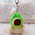 Cute capybara plush keychain wearing an avocado hood with a metal hook closure - Frog Hat Light Brown + Silver Clip