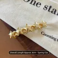 Minimalist gold star spring hair clip with five connected stars in 8cm length - Gold Star Spring Clip