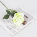 Single lifelike velvet yellow artificial rose with green leaves on a magazine page - Large Velvet Light Green
