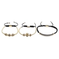 Dettaglio di tre braccialetti intrecciati regolabili con corona dorata e zirconi da uomo - Set Oro Zircone Blu