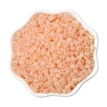 Pink 4mm cat eye glass beads in a white ceramic petal bowl for DIY jewelry making - Orange