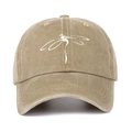 Close-up of khaki washed canvas baseball cap featuring a white dragonfly graphic print - One Size / Khaki