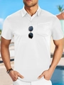 Detail van wit mesh poloshirt met ademende stofstructuur en handige borstzak - S / Wit