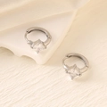 Detail of silver hoop earrings featuring square princess-cut cubic zirconia settings - Silver (Square Stone)