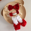 Detail of red velvet bow headbands with tiger embroidery and white cotton baby socks - 4640 Tiger Headband + Socks