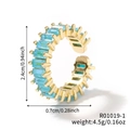 Dettaglio di un anello dorato a ingranaggio con pietra turchese e dimensioni esatte - Oro-Blu Turchese