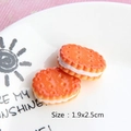 Macro shot of 1.9x2.5cm resin sandwich cookie miniatures for DIY crafts on white plate - Sandwich Biscuit