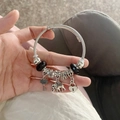 Silver steel cable bracelet featuring elephant and heart charms with black beads - Black Cupid & Elephant Bracelet