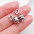 Silver magnetic jewelry clasps with lobster claw design shown on fingers for scale - Antique Silver Gourd-Shaped Magnetic Spring Clasp / 20x7mm