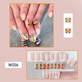 Detail view of W016 butterfly nail stickers in orange and yellow with black outlines - W016 Fluttering Butterflies
