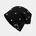 Detail view of black knit beanie featuring white pearls and a silver metal ring accent - Pearl Style
