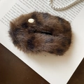 Detailed view of plush leopard print hair clip with handmade metal button on a book - Duckbill Hair Clips / Dark Coffee Leopard