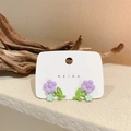 Elegant purple and green flower stud earrings on a REINA display card with a woody background - Purple Flower (Silver Post) (1586)