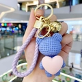 Blue knit texture bear keychain with pink heart, purple leather strap and gold bell - Purple