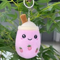 Detailed close-up of a pink bubble tea plush keychain with strawberry embroidery - 11cm / Pink