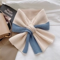 Detail of blue and beige ribbed knit scarf showing texture and cross-over design - Sapphire Blue
